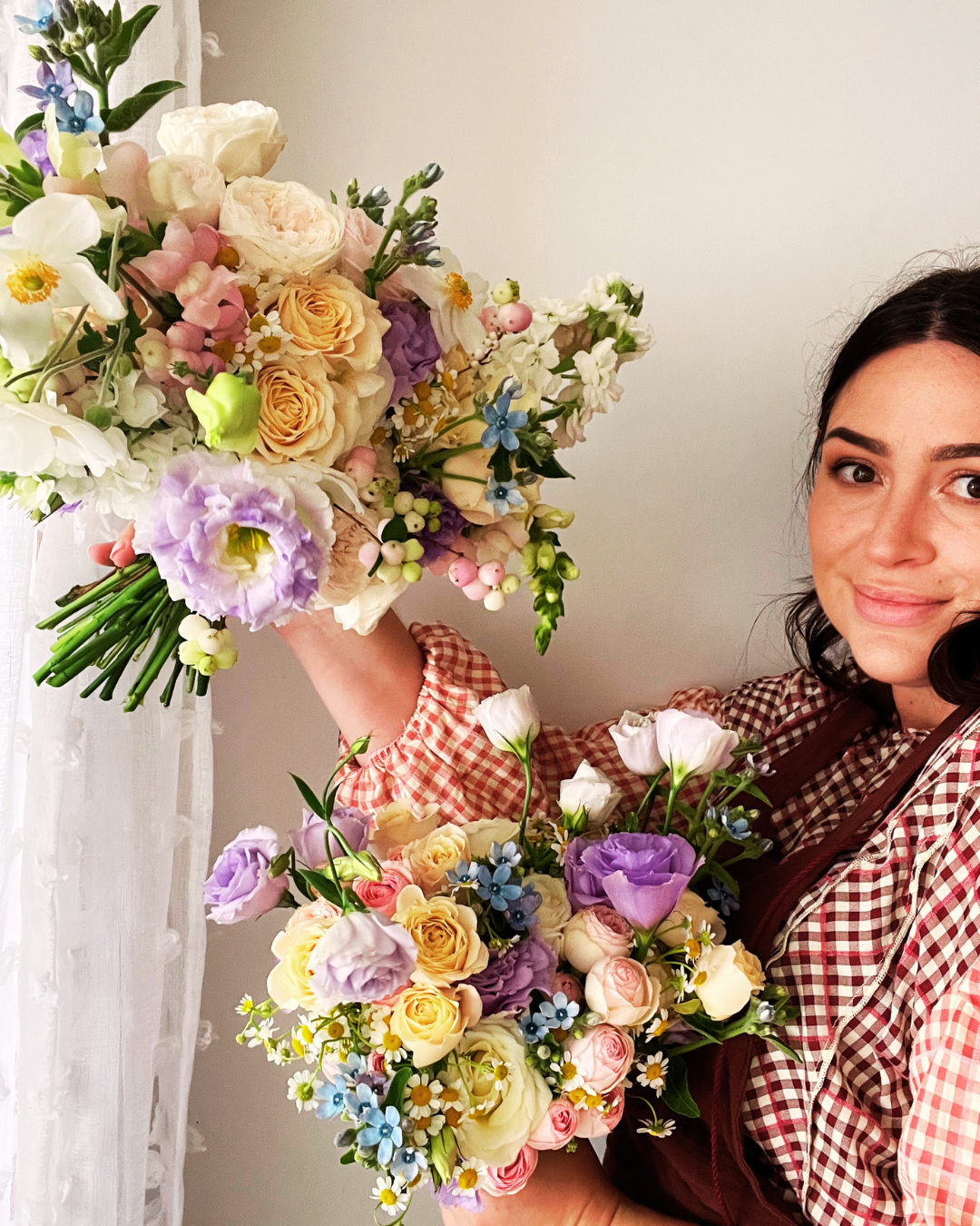 Sarah standing with flower displays