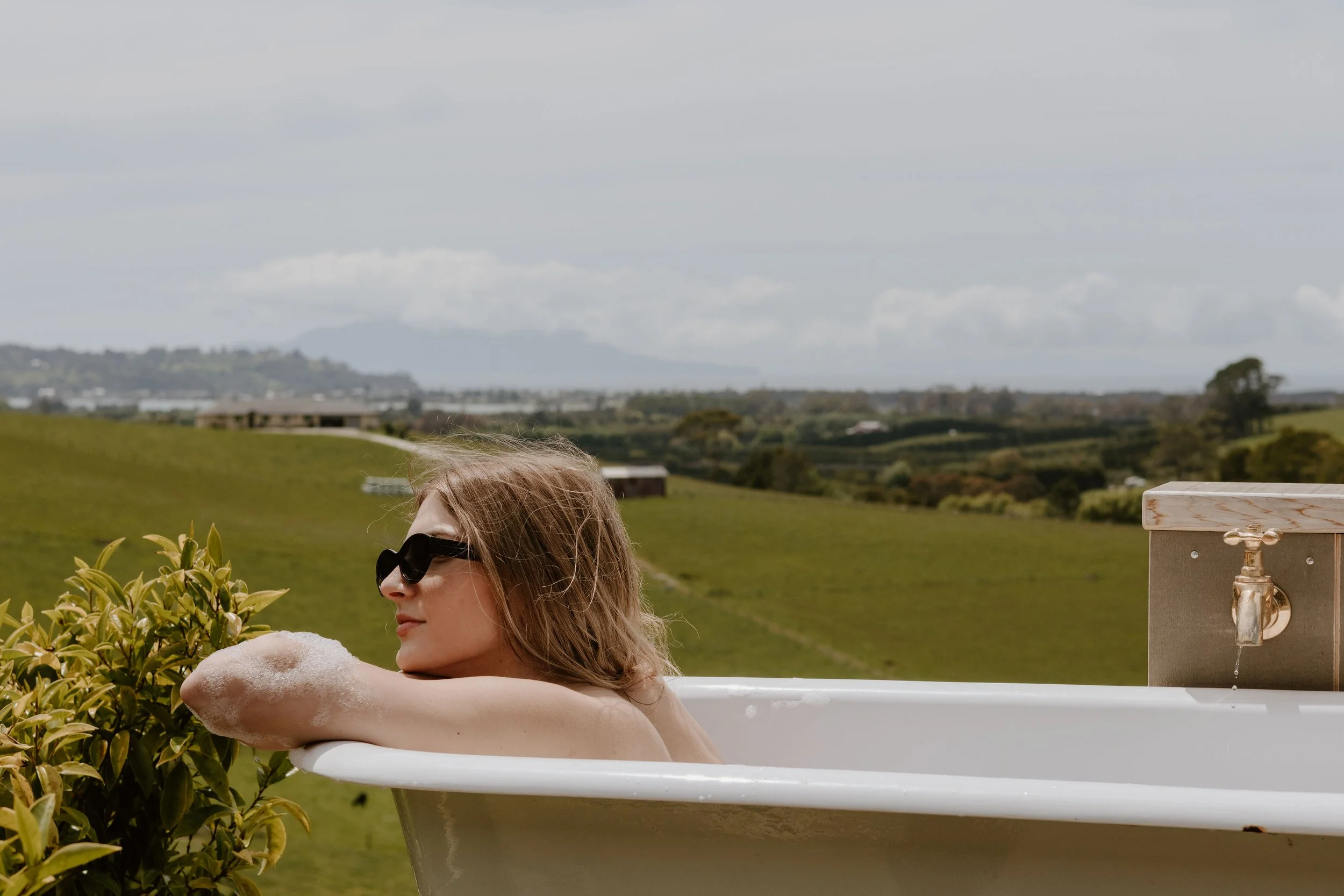 Lady in Bath enjoying her accomodation with Matakana Boutique