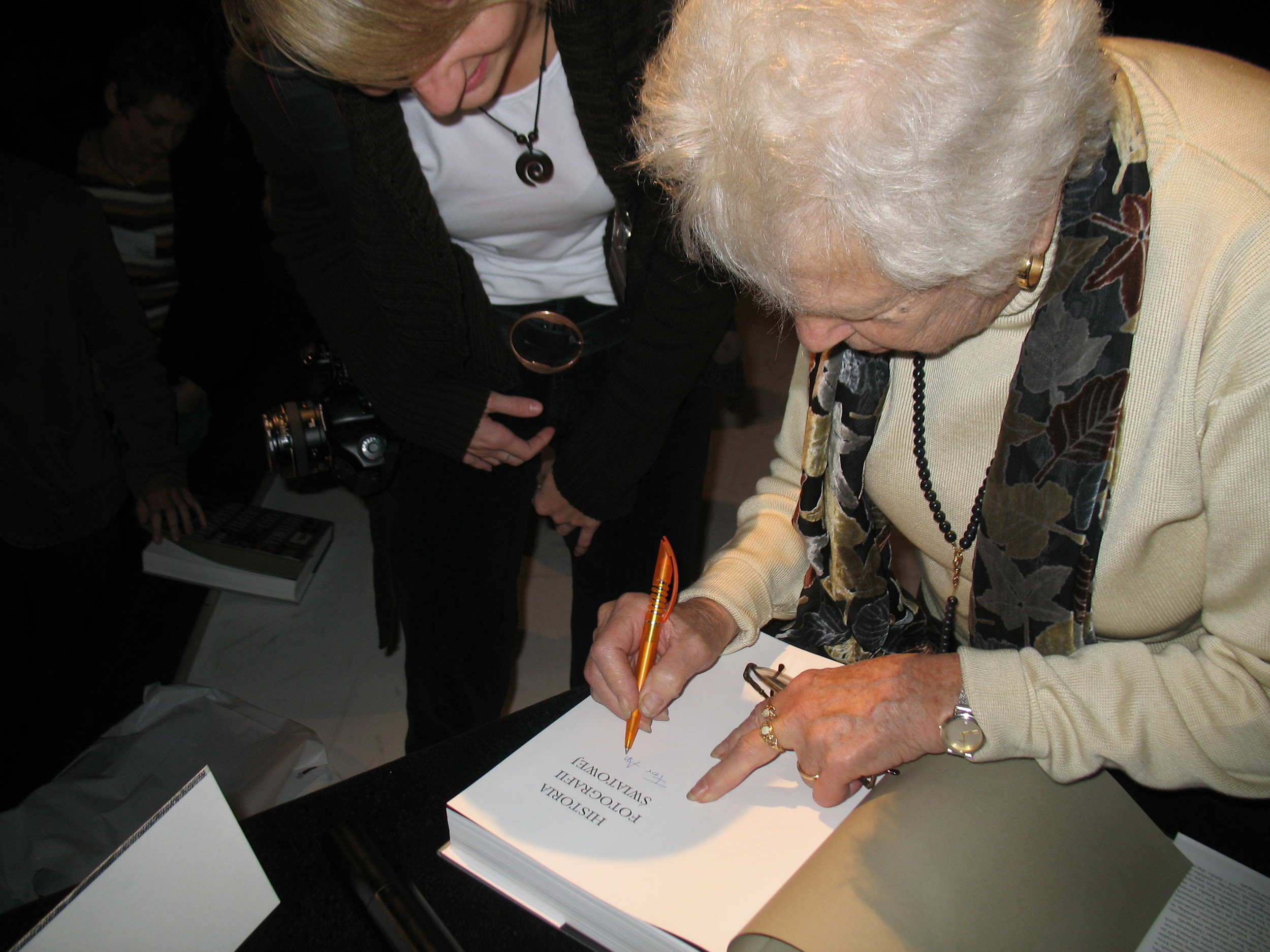 Naomi Rosenblum autographing her book "A World History of Photography"