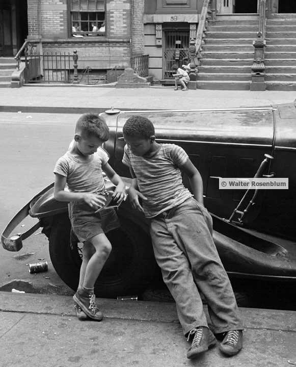 two boys leaning on car.jpg