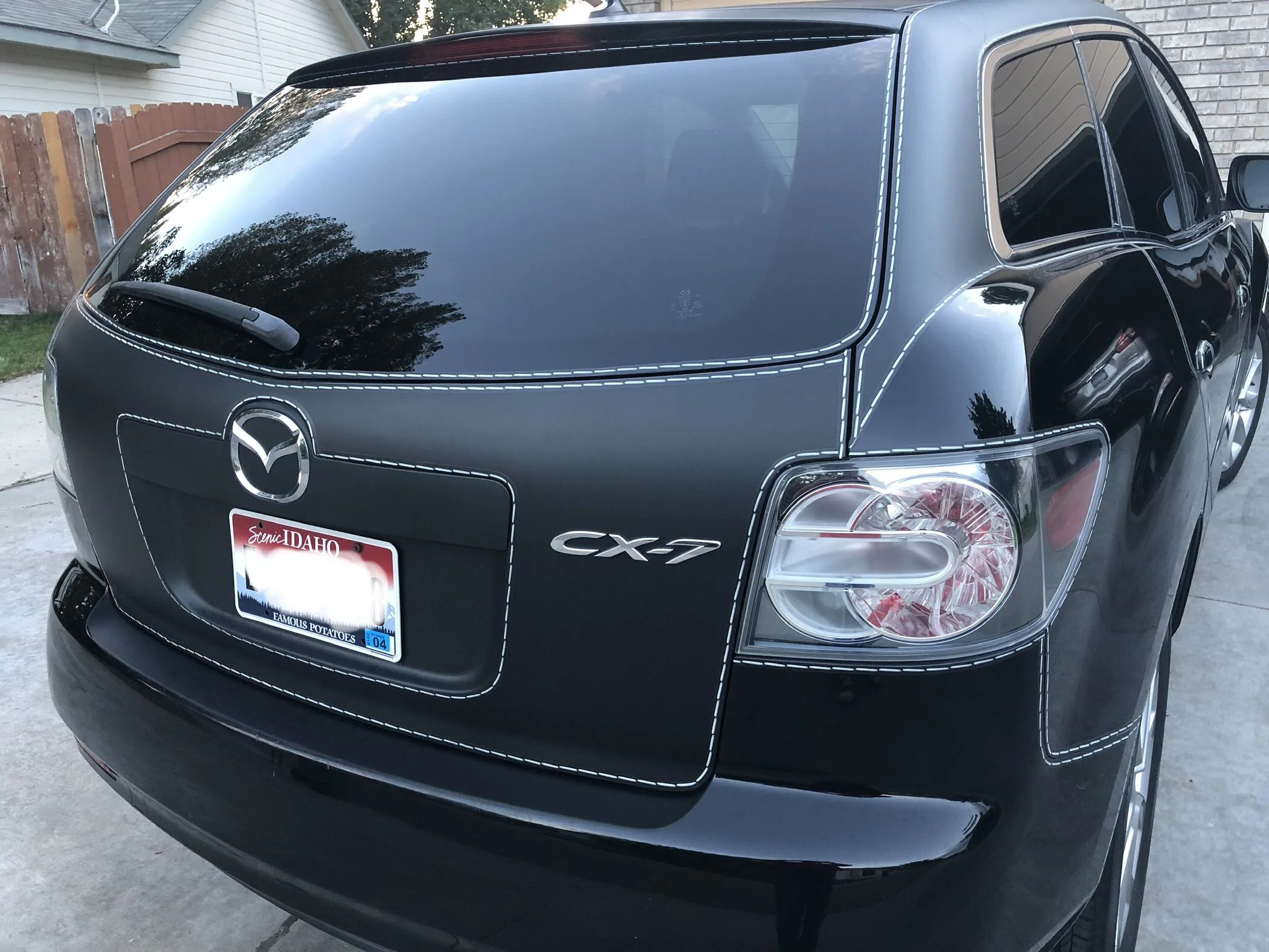 White Stitches on a Black Background Vehicle Wrap