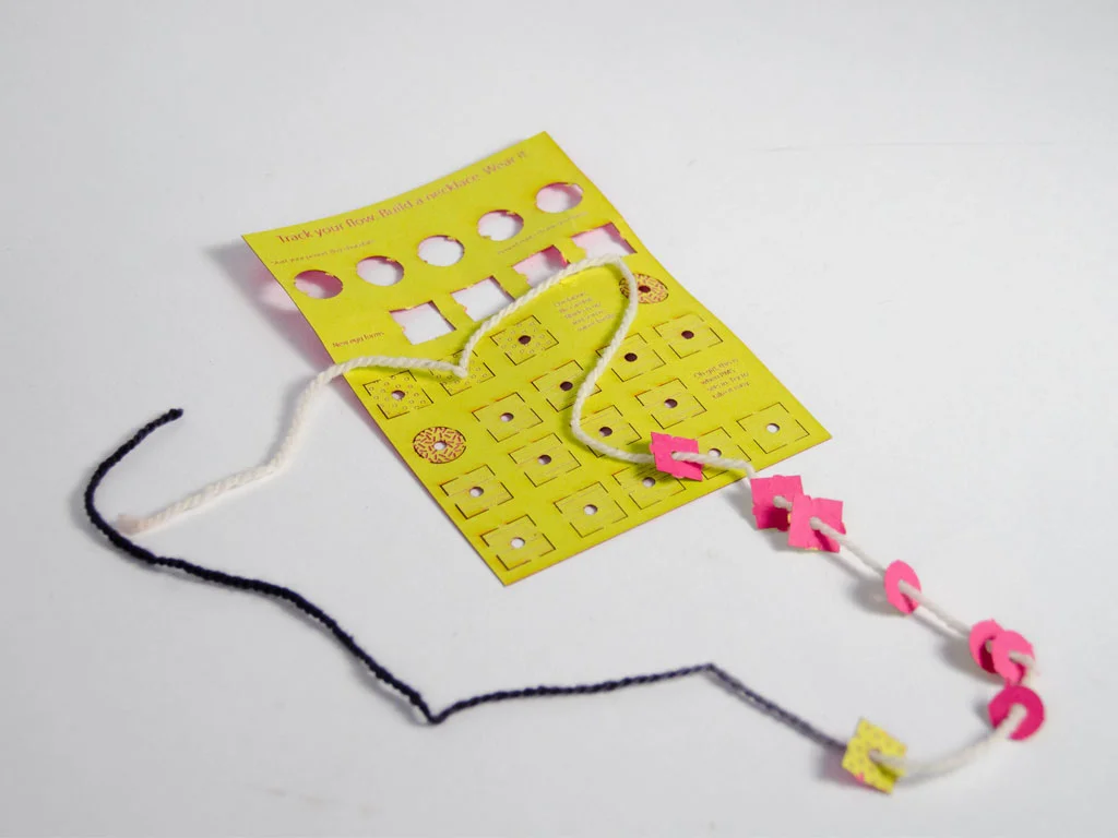 An earlier prototype of the necklace -- imagined as something that could be given away for free.