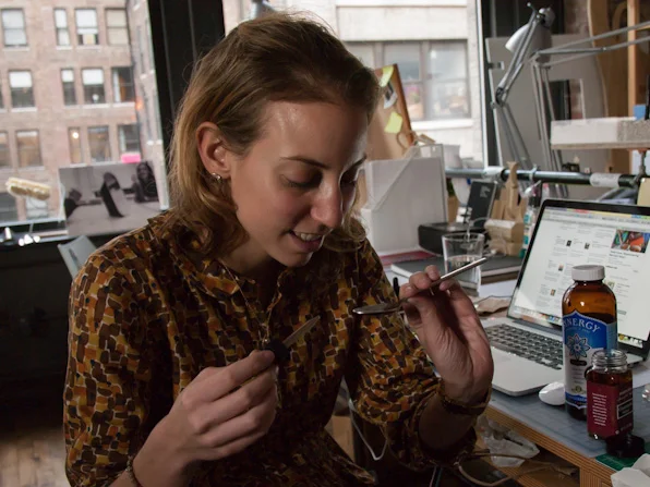 Sampling the tinctures during the process of making bitters.
