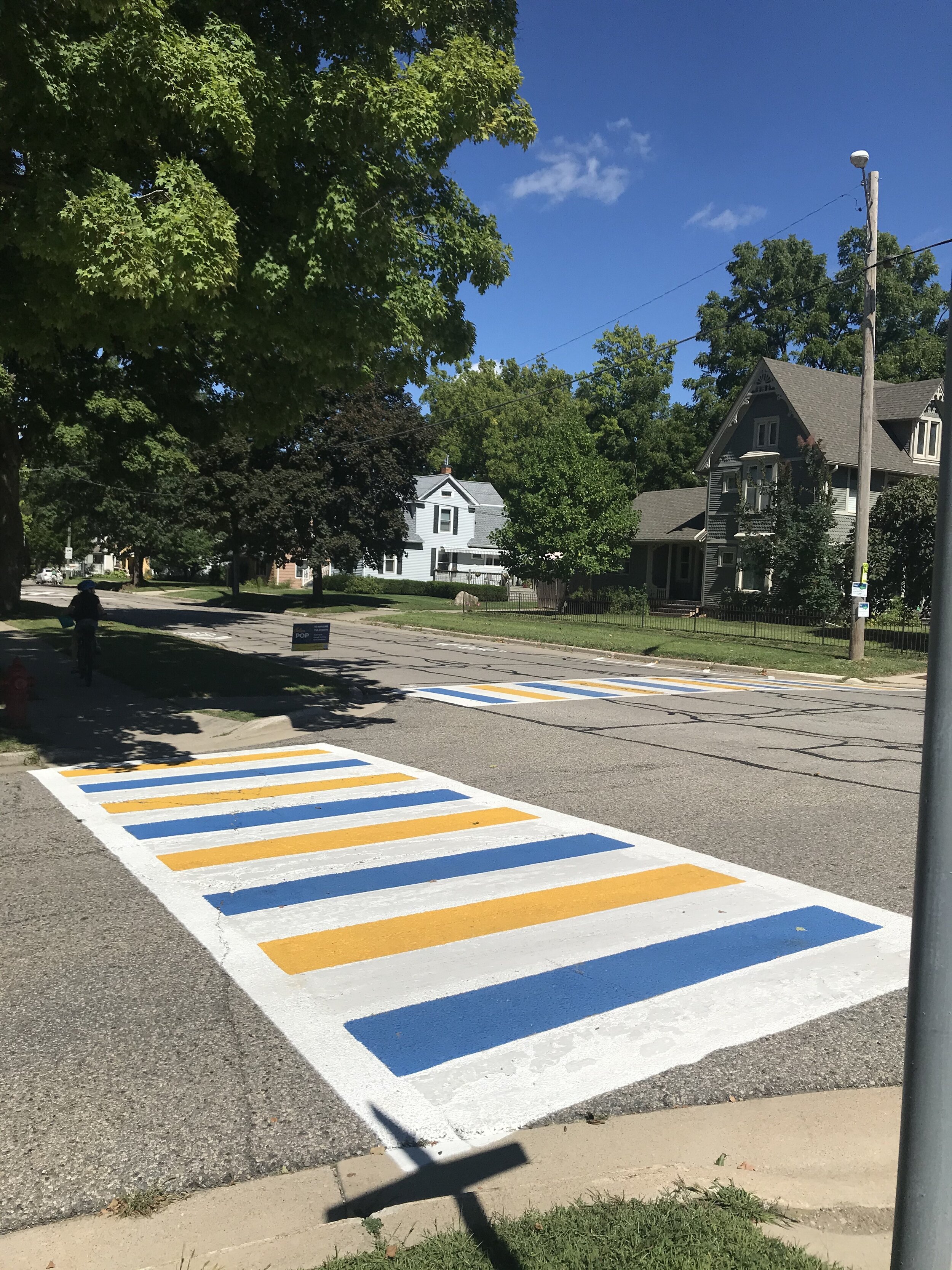  Brightly colored crosswalks at the intersection of Railroad Street and McKinley Street. 