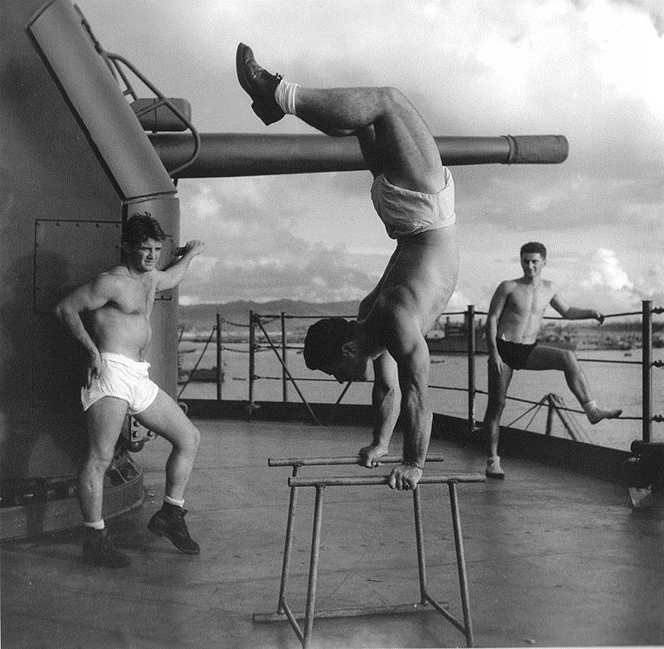 Horace Bristol - Crewmen exercising aboard a submarine tender (AS) at an advanced base. Men having a workout on deck, May 1945.jpg