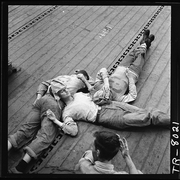lossy-page1-600px-Sailors_sleeping_on_flight_deck_of_the_USS_Lexington_CV-16._-_NARA_-_520899.tif.jpg