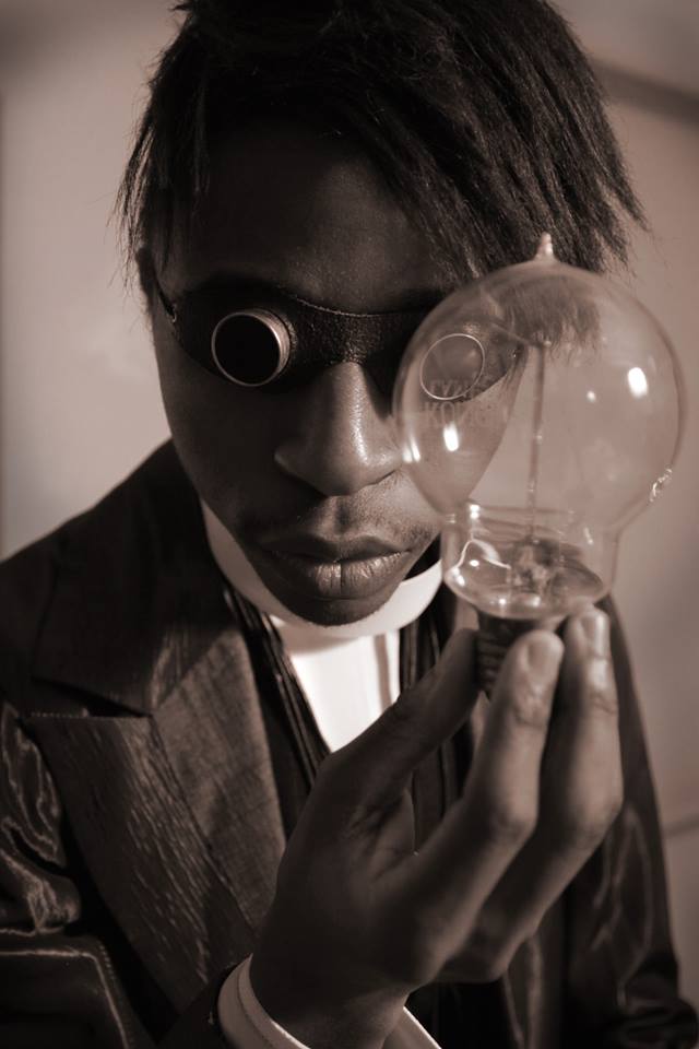 Steampunk guy holding a lamp