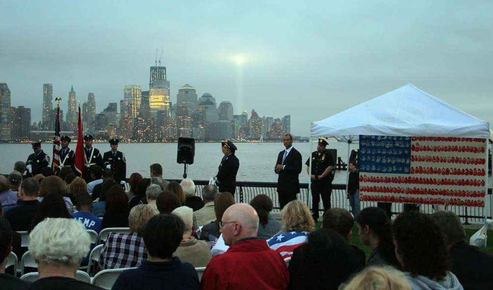 The flag on Pier A for the 10th anniversary with the Freedom Tower under construction, and the annual ‘Tribute In Light'.