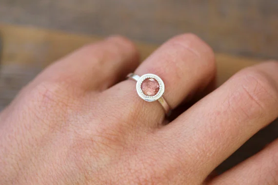 Oregon Sunstone 6mm Halo on Hand.jpg