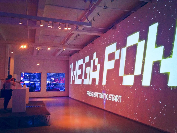 Client: Art Director's Club / Agency: Grand Army / Creative Direction, Coding, and Electronics MEGAPONG is a 60-foot-wide version of the classic video game Pong, created in collaboration with Grand Army for the ADC Young Guns 11 Launch Party. Beer-lubricated party goers used our handmade joystick controls to play on the giant 3,072 x 768 screen, whipping their heads from side to side to follow the ball.