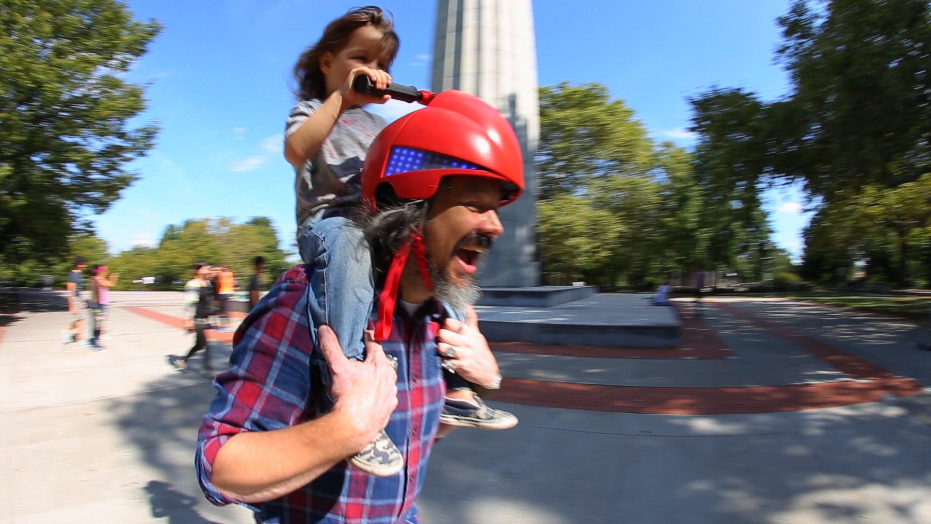 In-house Prototype / Agency: PARTY / Creative and Tech Direction Piggyback Driver is a toy helmet that empowers kids to drive their parents. Riding on a parent's shoulders, kids can turn the steering handles to control the ride and vibrations inside the helmet tell parents which way to go. There's also a horn to honk, a turbo button, and colorful LEDs that show how fast you're going.