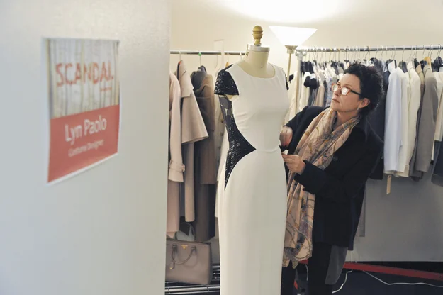 If anyone knows an Olivia Pope look, it’s Lyn Paolo, who’s been the costume designer for Scandal since the show’s pilot. “I love the idea of having Olivia, this beautiful woman, in a room full of men in dark suits, and she’s in that white suit,” the British-born Paolo said of dressing Kerry Washington. “She just epitomizes strong femininity. I wanted her to just sort of glow, and ultimately look so feminine, and very Jackie O. She’s Kate Hepburn, basically.” Paolo dresses the entire cast of Scandal — from Fitz down to David — but Olivia Pope gets her own wardrobe closet, which is large enough to hold two walls of trench coats, white pants, silk pajamas, and all those Prada purses. There’s a table lined with scarves, and a full-length mirror complete with pedestal for Washington to stand on during fittings. The only time Paolo and series star Kerry Washington have ever disagreed on wardrobe was during the pilot, when Paolo thought Pope should be in skirts, and Washington firmly pushed for pants. “In the end, she was right,” Paolo admitted. Before Scandal , Paolo worked as a costume designer on ER , which she credits with her ability to use clothing to further the plot. “I learned really fast how to tell a story through clothes on that show,” she said. Now she currently juggles working on Scandal and Showtime’s Shameless . But Paolo let BuzzFeed in on her secrets behind what clothes end up on Pope, and how they help to tell the scandalous stories.