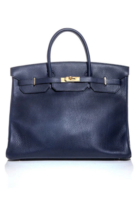 Hermès vintage tote, $12,759, matchesfashion.com. COURTESY MATCHES FASHION
