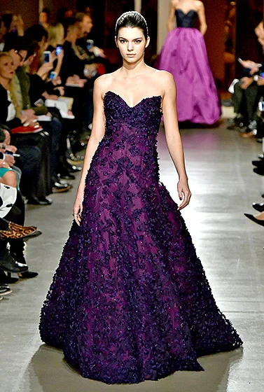  Credit: Slaven Vlasic/Getty Images Purple princess! Walking in the first ODLR show since the designer's passing (now headed by Peter Copping), Jenner embodied elegance in an embellished eggplant ball gown in the Big Apple on Feb. 17.