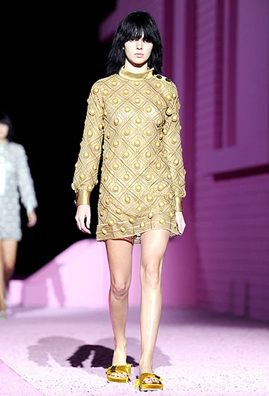  Credit: Barcroft Media /Landov You under there? Kylie's older sister wore a shaggy black wig with long bangs for the Marc Jacobs show on Sept. 11, in New York. 