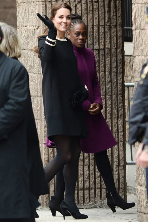 What: Goat coat and Jimmy Choo heels When: December 8 Where: Visiting the Northside Center for Child Development with the First Lady of New York in NYC. AP IMAGES