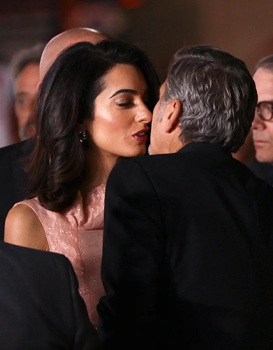 The happy couple share a kiss on the red carpet The Hollywood star admitted he didn't make a big deal of their first anniversary because the couple would have plenty more in the years to come. George told Extra 's AJ Calloway, "I had to start off by (attending) a Jerry Weintraub event… and then afterwards she and I got to sneak out and have a dinner." "That was it, just a little dinner?" AJ joked. "What are you gonna do, shoot off fireworks?" George replied. "You know sometimes you just go to dinner.