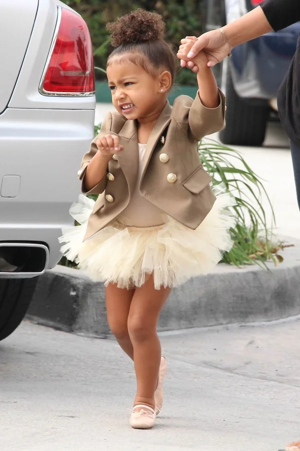 “I said no pictures,” the cutie yelled while walking alongside photographers who were snapping shots of the tot.