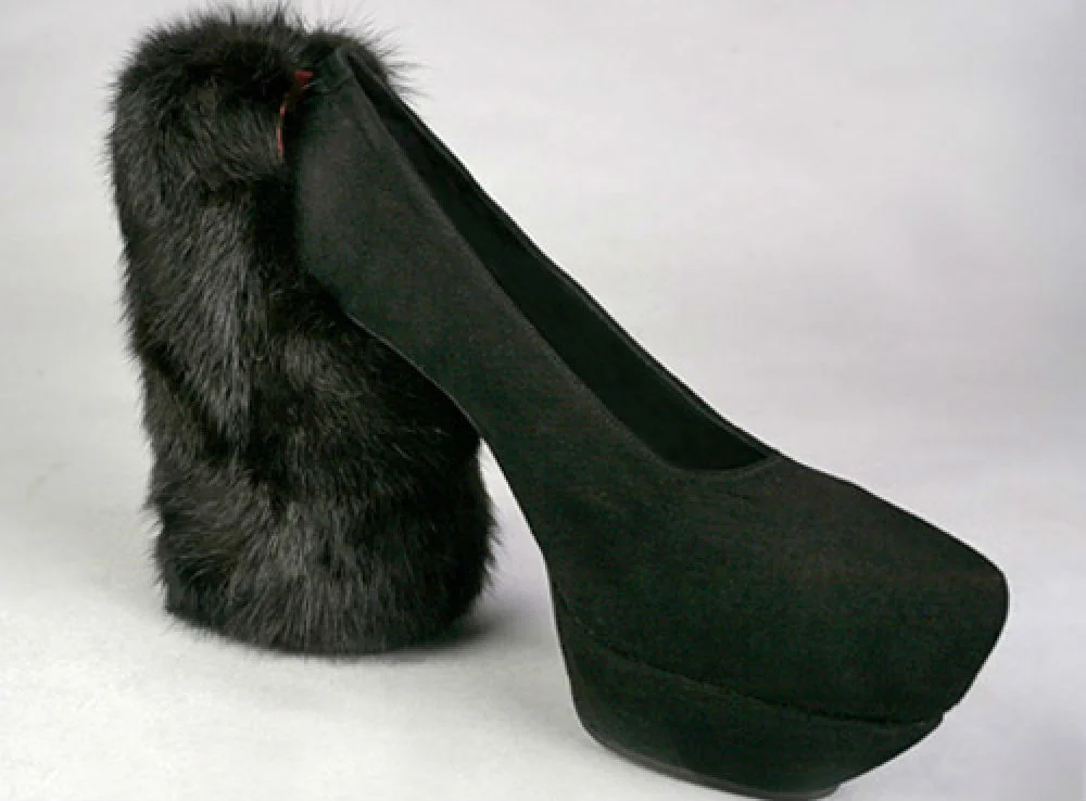 2. This furry monstrosity brings the concept of a chunky heel to a whole other level. We have a feeling that one of the Kardashians would probably wear them.