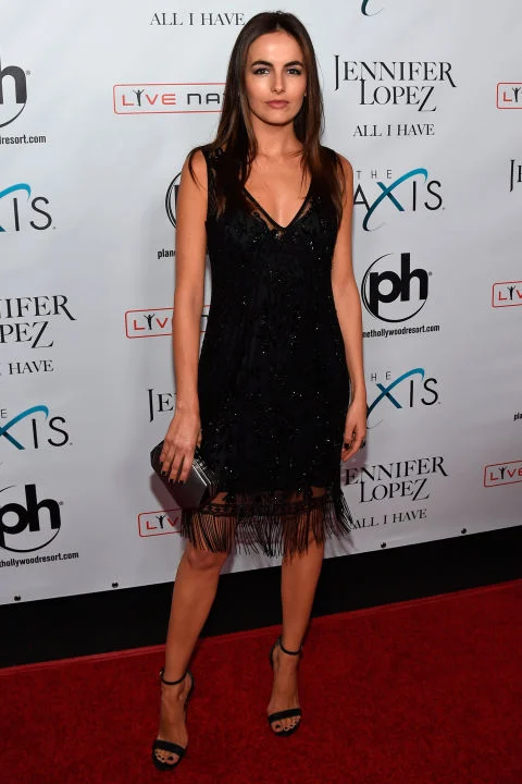 20 January Fellow J-Lo fan Camilla Belle kept her styling classic in a black fringed dress and matching sandals.