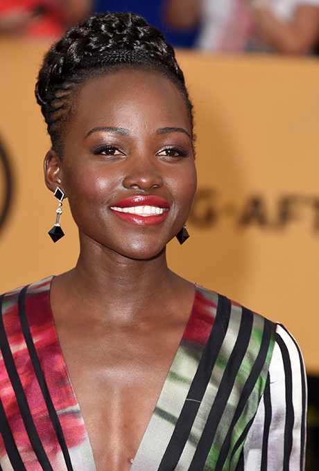 Lupita Nyong'o A great way to complement red lipstick? Go for deep plum-hues on the eye like Lupita did.