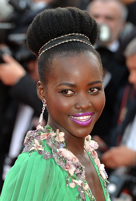Lupita Nyong'o's Oversized Top Knot A glam, oversized top knot like Lupita's will keep you as cool as you look. Add a blinged-out accessory for maximum impact.