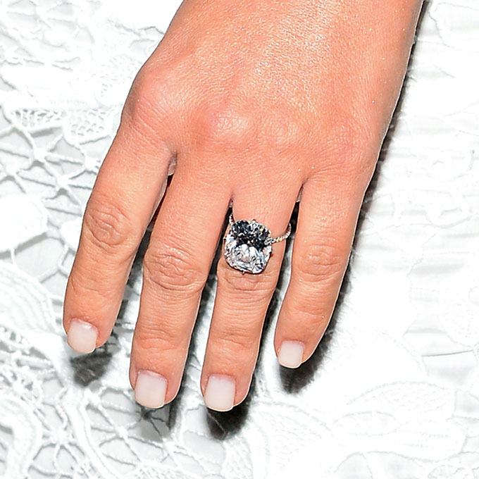 Kim Kardashian's Engagement Ring Like the rest of the world, we were captivated by the details of Kimye's big day, and months later we're still floored by her 15-carat engagement ring. West reportedly spent a cool $8 million to procure the eye-popping cushion-cut diamond ring (and 33rd birthday present!). The D flawless type 2A rock (which jewelry designer Lorraine Schwartz described as a the "perfect cushion-cut diamond") is set in a pavé band so delicate, it looks as though the diamond is floating on air. Photo: Getty Images