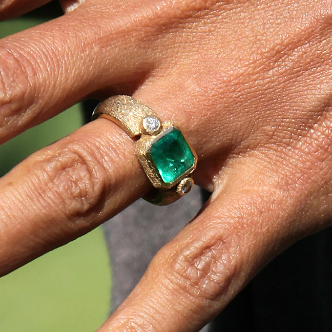 Halle Berry's Engagement Ring Set in a textured, hand-forged, yellow-gold setting, the ring's four-carat emerald — sourced from Colombia — is flawless in color and flanked by two diamonds. Berry's husband Olivier Martinez commissioned the one-of-a-kind piece from his Paris neighbor, jeweler Robert Mazlo. The ring reportedly contains codes and symbols in lieu of an inscription, which only its wearer can understand. Photo: Getty Images