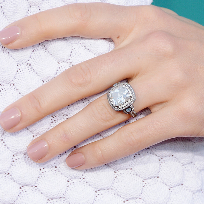 Jessica Biel's Engagement Ring Jessica Biel's once elusive engagement ring from love Justin Timberlake features a slightly rounded square-cut diamond surrounded by two rows of smaller stones. Notable details include scrolling rope-style sides and the use of blackened platinum, which creates a unique, vintage effect. Photo: Getty Images