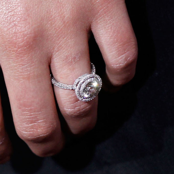 Natalie Portman's Engagement Ring The actress wears a round-cut diamond ring encircled by a "halo" of pavé diamonds by Jamie Wolf . Photo: Michael Buckner/Getty Images