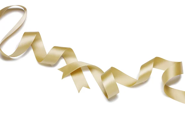 RIBBON You're going to be getting a lot of silver, gold, and lace-trimmed ribbon in the coming weeks. Save them. A long, three-quarter-inch piece is what you're looking for—specifically one that's silky and lush, nothing hard or crinkly. Wrap it around a low, wavy ponytail and don't obsess about the knot: The messier and more lopsided it is, the better.