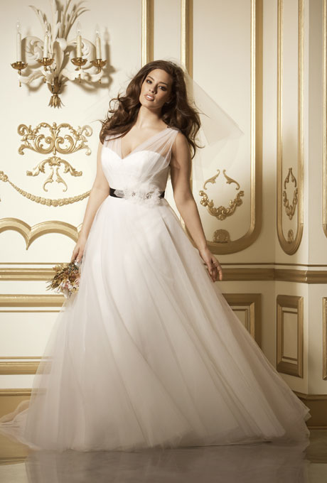  Photo: Courtesy of Wtoo Style 11713, "Phoenix" ivory tulle v-neck, v-back with full skirt, $1,600, Wtoo See more Wtoo wedding dresses.