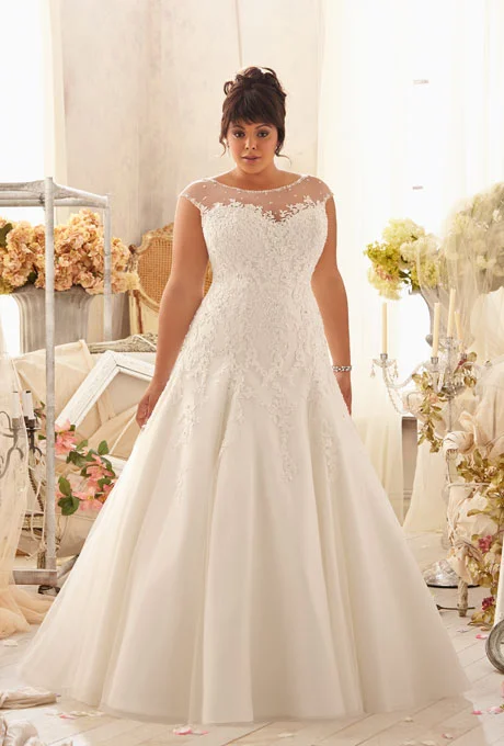  Photo: Courtesy of Mori Lee Style 3151, venice lace appliqués on net with crystal beaded trim, $1,180, Mori Lee See more Mori Lee wedding dresses.