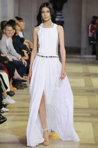 Carolina Herrera Only Mrs. Herrera can modernize a traditional silhouette with clever pleat work and add built-in jewelry through a metallic belt. Photo: Indigitalimages.com