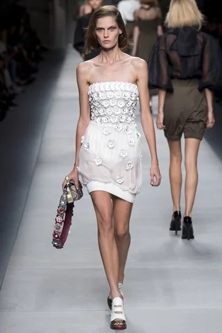 Fendi For the sports fanatic bride, a strapless minidress with athletic influences gets a dose of girliness with floral embellishments. Photo: Indigitalimages.com