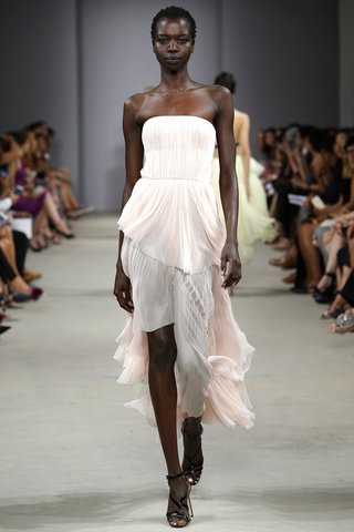 J. Mendel A strapless pleated dress with a cascading train acts as the ideal dress for the bride who wants a pretty-in-pink moment. Photo: Indigitalimages.com