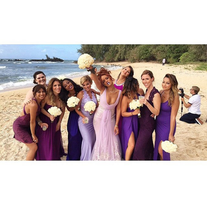 When the ultimate Bad Gal is your bridesmaid, BFF, and boss, you know you're in for a good time at your wedding. The superstar posted photos of her pal Jennifer Rosales's Hawaiian wedding day , which featured Rihanna herself in a stunning lilac Badgley Mischka gown. The only thing better than her curve-hugging bridesmaid dress? The "bridesmaid" and "bride" robes the whole party donned before the Rastafarian-themed bash. Photo: Rihanna via Instagram