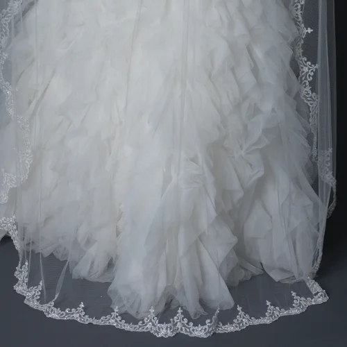 Beautiful 72" long waltz length scalloped edge bridal wedding veil accented with rhinestones, seed beads, crystals and pearls Length: 72" long x 72" wide Color: White or Ivory