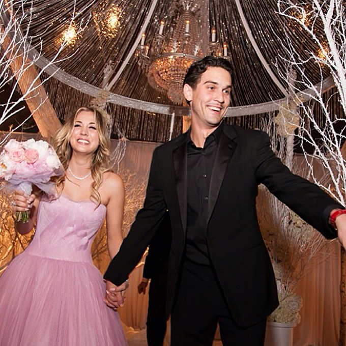 Photo: Kaley Cuoco Sweeting via Instagram Kaley Cuoco Sweeting The custom pink Vera Wang confection that the Big Bang Theory star wore to marry Ryan Sweeting at their New Year's Eve wedding strongly evoked Wang's Fall 2014 runway collection , which she designed in shades of pink. Cuoco donned the strapless tulle ball gown with a sweetheart neckline for the ceremony before changing into a shorter red dress for the reception.
