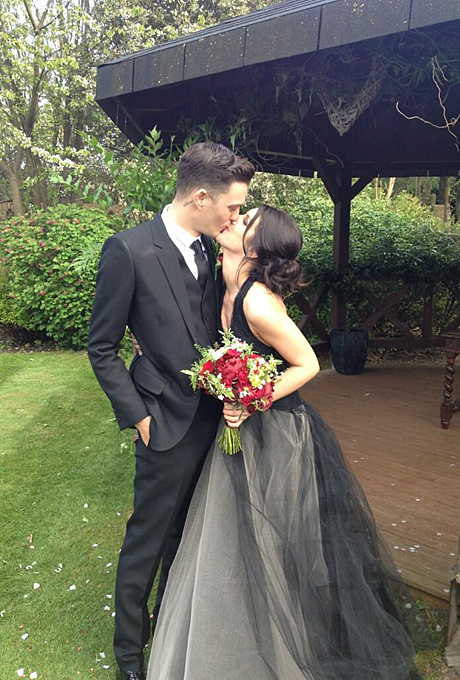 Photo: Shenae Grimes via Twitter Shenae Grimes Grimes played a high school student on the reboot of 90210 , but the Vera Wang dress she wore to marry fiancé Josh Beech in May 2013 was anything but childlike. For their London wedding, Grimes walked down the aisle in a black gown with a tulle skirt and halter neckline paired with romantic-goth touches including a red rose bouquet and brooch-accented updo.