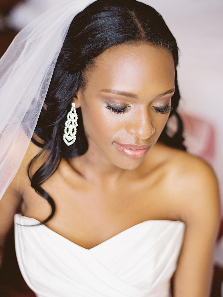 PHOTO BY VICKI GRAFTON PHOTOGRAPHY Strobing (the latest highlighting technique) makes her face glow— and shows off her amazing cheekbones. A lightened-up version of a smoky eye and shimmery peach lip gloss finish off this elegant look. From the album A Bright Summer Wedding in Fort Belvoir, VA