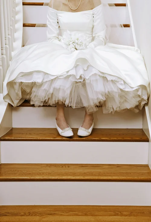 Your bathroom breaks aren't something we'd normally discus in polite company. But when it comes to your wedding, making plans to pee is actually pretty important — because as luck will have it, you'll need to beeline for the bathroom the second you slip on your wedding dress, and dart from the dance floor in the middle of John Legend's ode to your union . So here's how to take a bathroom break in your dress. Sit on the toilet backwards. Yes, you read the right. When it comes to going to the bathroom in your wedding dress, it's best to straddle the toilet seat so you're facing the tank and the wall. Why? This ensures the back of your dress and its train spills onto the floor and not into the toilet. Ask for help. On any other day, using the restroom is a private ritual. But on your wedding day, it's not only appropriate but expected to ask for helping hands . Your female friends, bridesmaids, and mother will be more than willing to stand beside you, holding your dress, as you squat over the toilet. If there's room, take two women with you into the stall — one to hold each side of your dress and prevent it from taking a swim in the toilet. See more: Things to Remember When You Go Wedding-Dress Shopping Steal the handicap stall. If it's free from use, don't feel bad about ducking into the handicap stall. Tonight, your billowing ball gown is your handicap. The extra square feet this stall offers will make it more comfortable for you and your maids to manage your dress, and will (hopefully) protect you from getting too close for comfort. Schedule enough time. Try as you might, you can't take a quick bathroom break in your wedding dress. Best case scenario, three women have to cram into a small space and help you relieve yourself. Worst case, there's simply room for helping hands and you'll have to slip in and out of your dress in order to pee. That will take at least 20 minutes, so plan accordingly, and don't break for the bathroom if you've only got three minutes until you're set to slice your cake . Set up times to go. You won't be able to anticipate each bathroom break you'll need, but you'll make your wedding day run so much smoother if you schedule a few times you know you'll want to dive into a stall. Think: Before you leave for the ceremony, immediately before the reception, and directly after the toasts. This will reduce your need for emergency bathroom breaks, and ensure you always have help. Keywords: Wedding Etiquette Wedding Planning