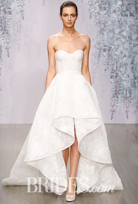 Monique Lhuillier's fall collection opened with this sweet Chanitlly lace strapless sweetheart dress with a high-low waterfall skirt. A mix of traditional and modern that perfectly nails the high-low trend. Photo: Luca Tombolini / Indigitalimages.com