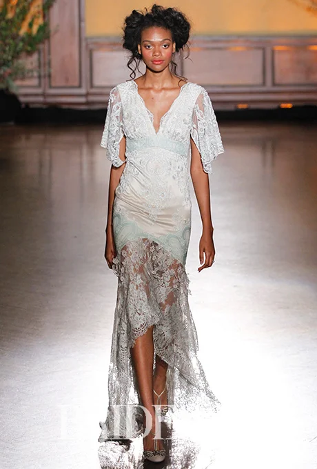 Claire Pettibone 's lace version of high-low is pure vintage romance with a silver lace overlay, satin body, and details perfect for that "Something Blue." Photo: Gerardo Somoza and Alberto Maddaloni / Indigitalimages.com