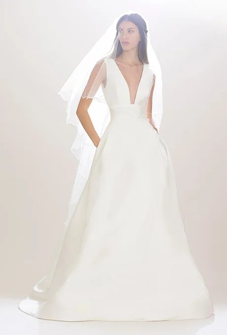 "Freddie" silk-crepe sheath wedding dress with an intricately draped and beaded neckpiece of alabaster, rhinestone, and chain, Hayley Paige Photo: Gerardo Somoza and Alberto Maddaloni / Indigitalimages.com