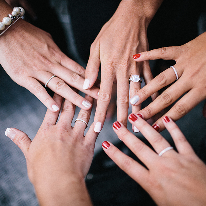 Get the girls together for a wedding ring pic with your already-married bridesmaids! Photo: Lauria & Gennia of Docuvitae