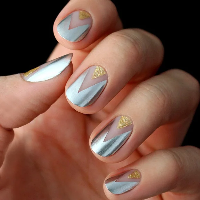 A geometric gold-and-silver manicure. Photo: LuLu's via Instagram