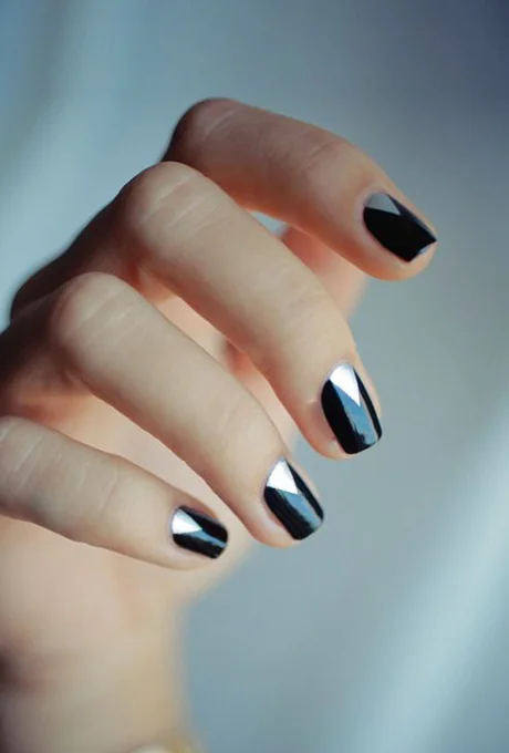 A black-and-silver manicure. Photo: Hannah Baker via Pinterest