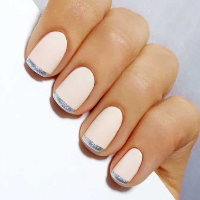 A blush pink French manicure with silver tips. Photo: Naomi Sinnett via Pinterest