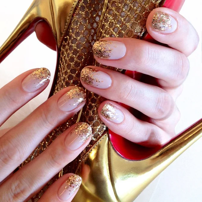 A nude manicure with gold sparkles. Photo: Jin Soon Choi via Instagram